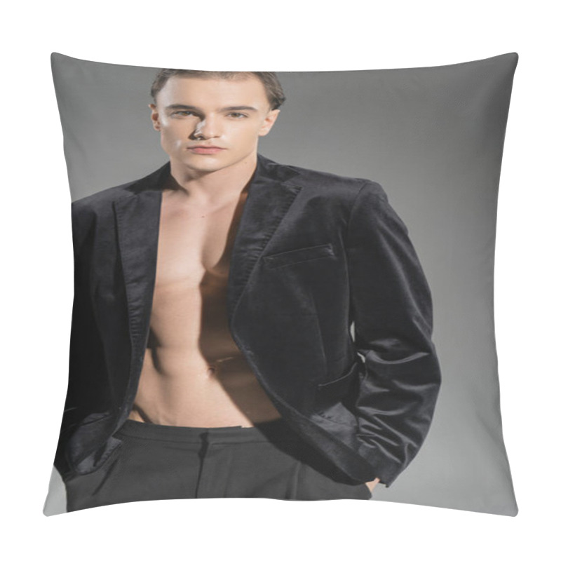 Personality  Self-assured And Alluring Man Wearing Black Silk Blazer On Shirtless Muscular Body, Standing With Hands In Pockets And Looking At Camera On Grey Background Pillow Covers