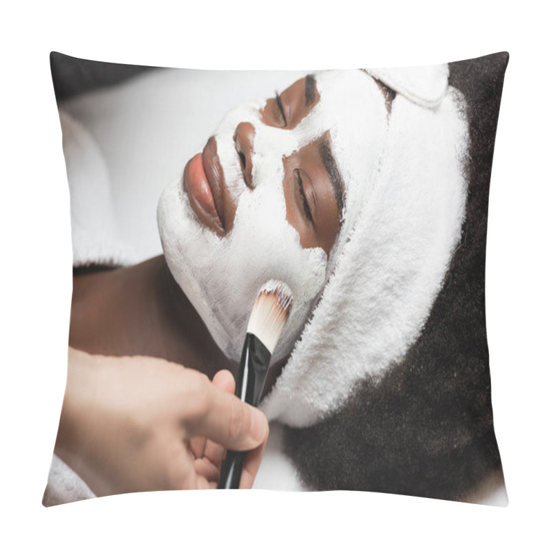 Personality  Close Up View Of Positive African American Woman With Headband Lying Near Spa Therapist Applying Face Mask On Cheek In Spa Salon Pillow Covers