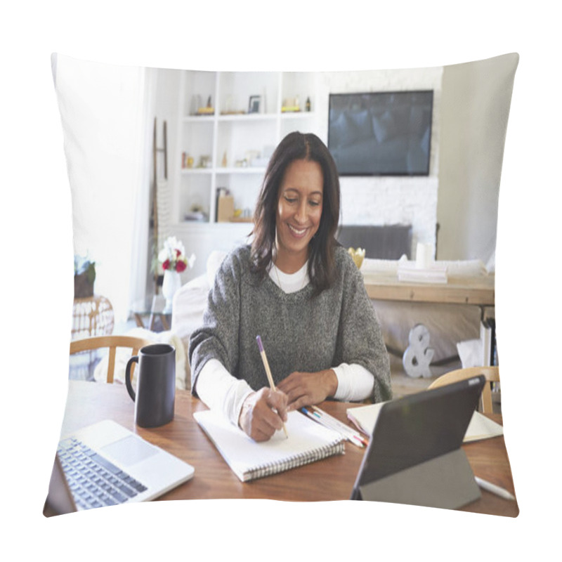 Personality  Happy Middle Aged Mixed Race Woman Sitting At Table In Her Dining Room Making Notes, Selective Focus Pillow Covers