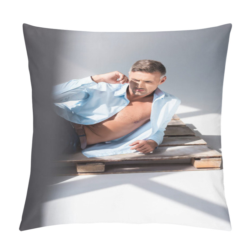 Personality  Attractive Adult Man Lying On Wooden Pallet On White And Looking Away Pillow Covers