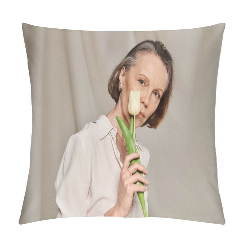 Personality  Mature Woman In Comfy Attire Holds Tulip Gracefully. Pillow Covers