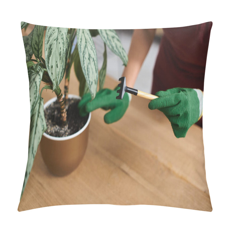 Personality  Woman Wearing A Green Apron Tends To A Plant In Her Greenhouse, Holding A Small Gardening Tool. Pillow Covers