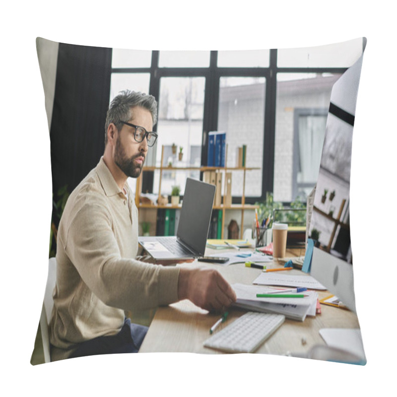 Personality  A Handsome Businessman With A Beard Works Intently At His Laptop In A Modern Office Setting. Papers And Office Supplies Surround Him On His Desk. Pillow Covers