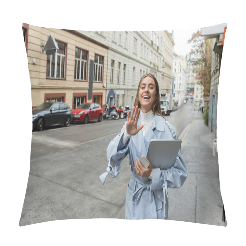 Personality  Happy Woman In Blue Trench Coat Holding Smartphone And Laptop While Waving Hand On Street In Vienna  Pillow Covers