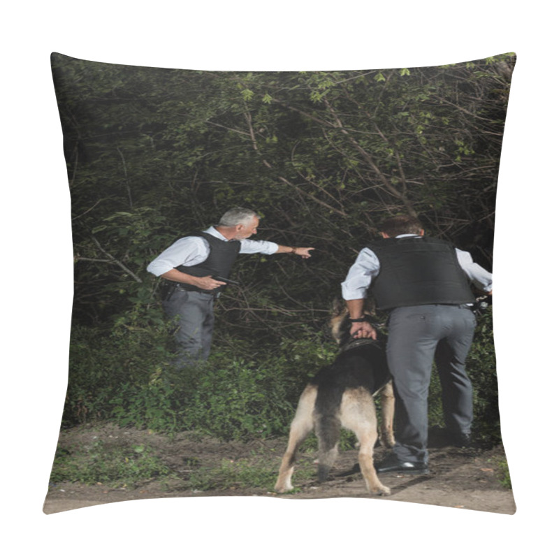 Personality  Mature Policeman With Gun Pointing By Finger To Colleague With Alsatian On Leash Near Forest Pillow Covers