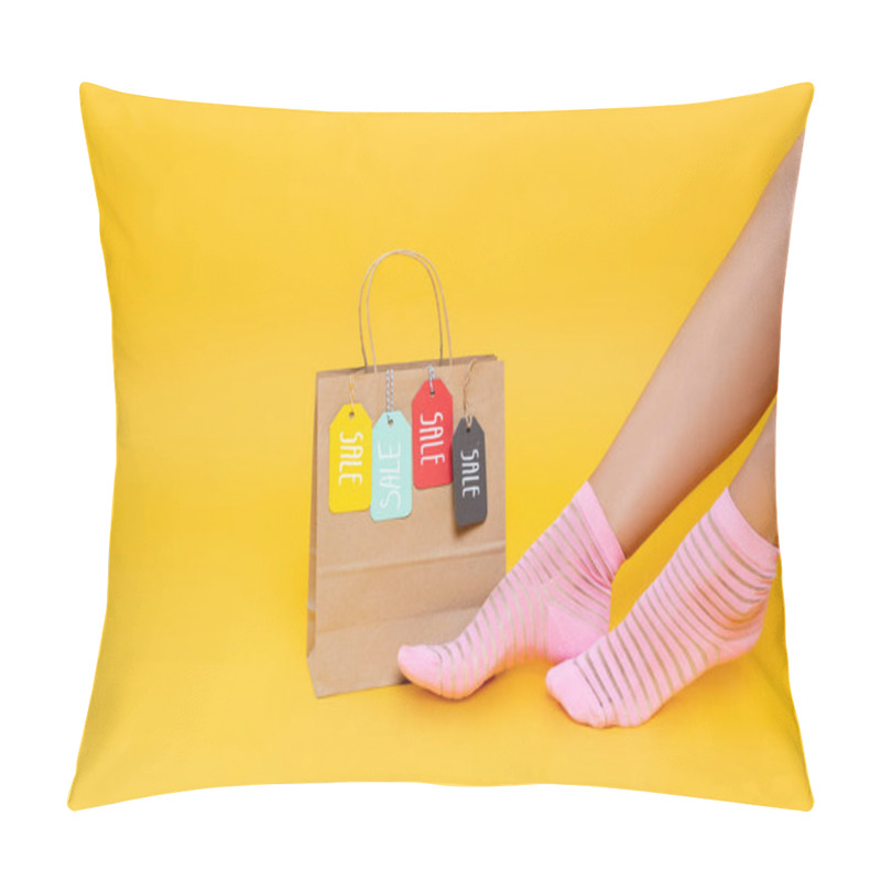 Personality  Cropped View Of Female Legs In Socks With Pink Stripes Near Paper Bag With Tags With Sale Words Isolated On Yellow Pillow Covers