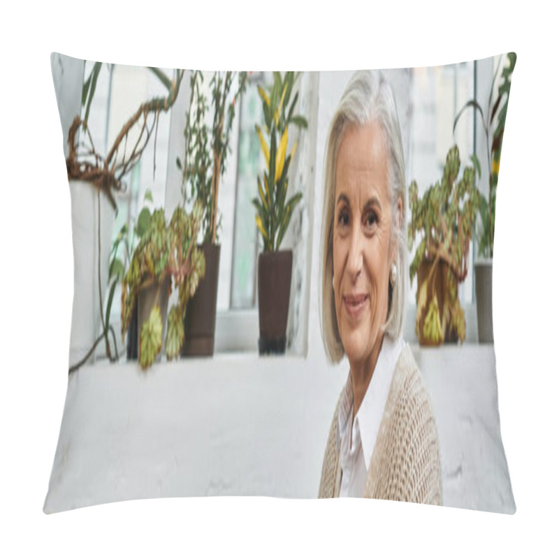 Personality  A Beautiful Woman With Gray Hair Warmly Smiles While Surrounded By Vibrant Greenery Indoors. Pillow Covers