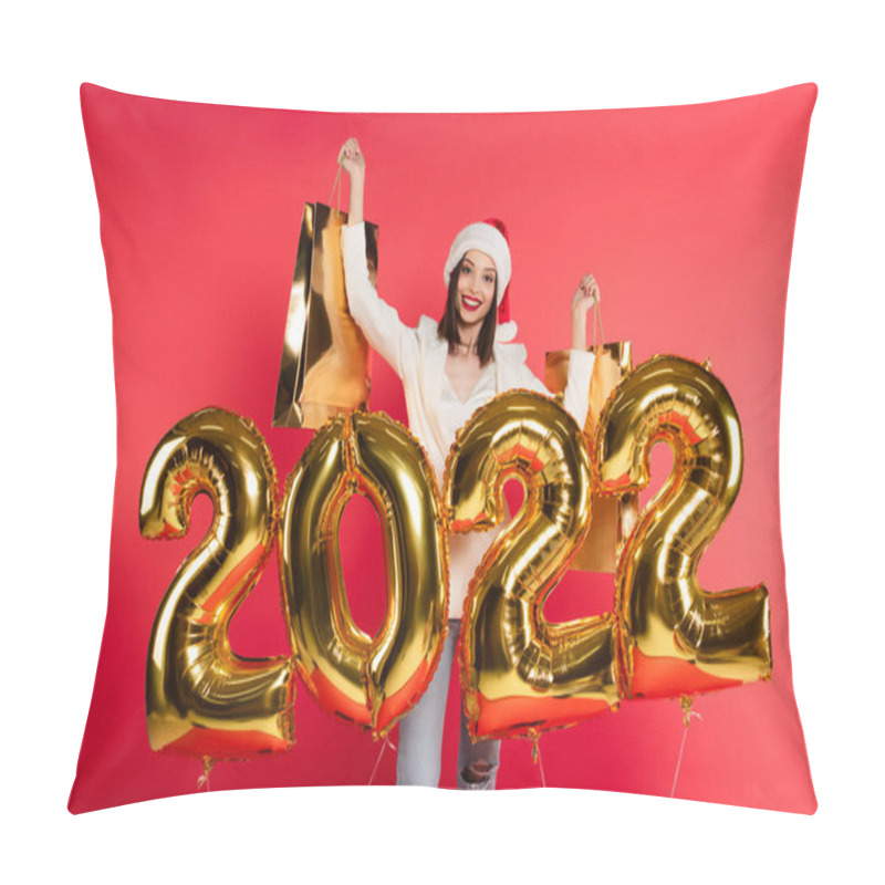 Personality  Cheerful Woman In Santa Hat Holding Shopping Bags Near Balloons In Shape Of 2022 Numbers Isolated On Red  Pillow Covers