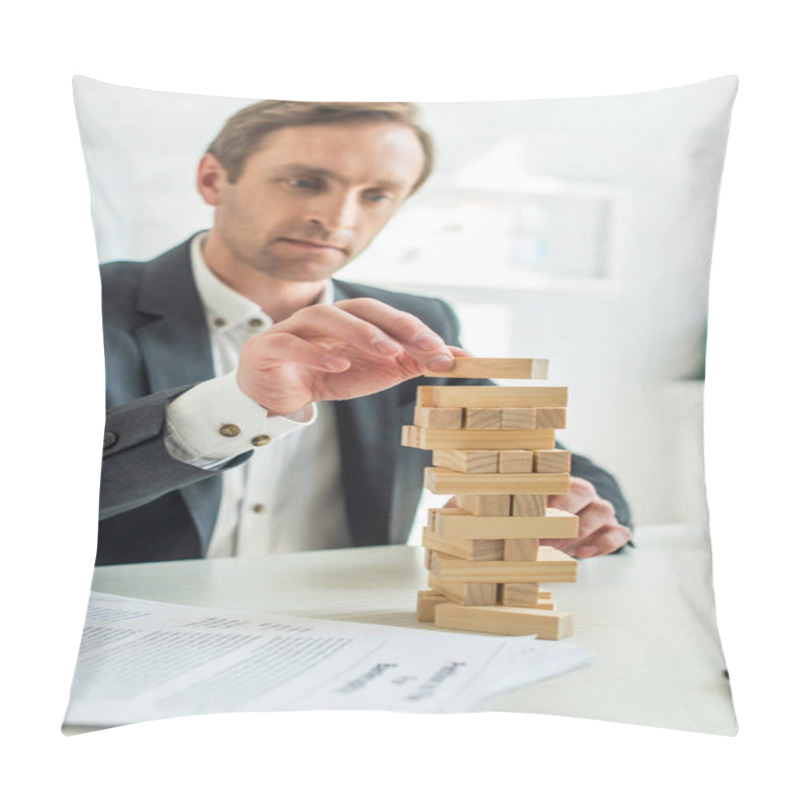 Personality  Focused Businessman Building Blocks Wood Game, While Sitting At Workplace With Blurred Petition For Bankruptcy On Foreground Pillow Covers