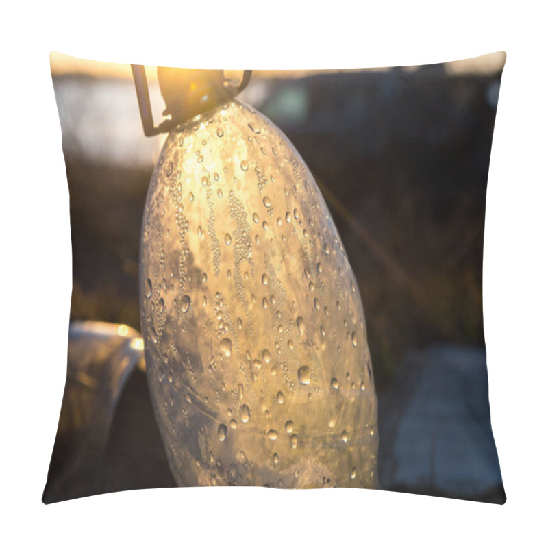 Personality  A Plastic Bottle Lies Discarded On The Ground, Surrounded By Grass And Foliage. The Bottle's Condensation Droplets And Sunlight Create An Interesting Visual Effect. Highlights Environmental Issues Pillow Covers