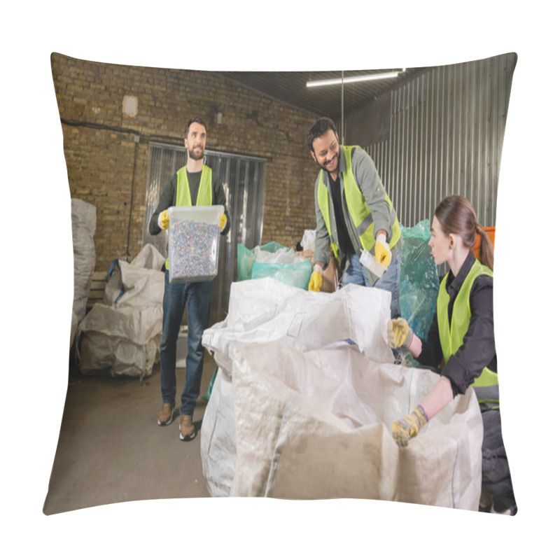 Personality  Smiling Indian Worker In Safety Vest And Gloves Giving Plastic Trash To Colleague Near Sacks And Sorter With Container While Working In Waste Disposal Station, Recycling Concept Pillow Covers