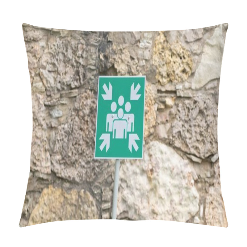 Personality  Green Assembly Point Sign Indicating A Safe Gathering Area, Mounted Against A Textured Stone Wall For Emergency Situations. Pillow Covers