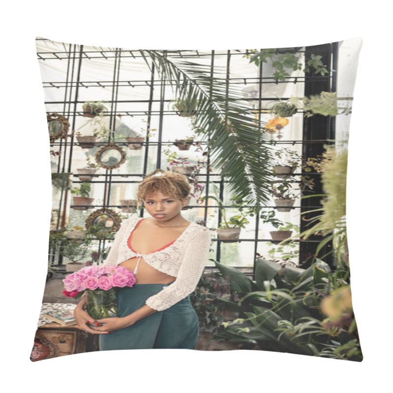 Personality  Trendy Young African American Woman In Summer Outfit Holding Vase With Pink Roses And Looking At Camera Near Plants In Indoor Garden, Trendy Woman With Tropical Flair, Summer Concept Pillow Covers