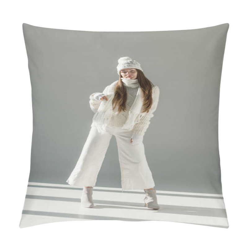 Personality  Attractive Woman In Fashionable Winter Sweater And Scarf Standing On White Pillow Covers