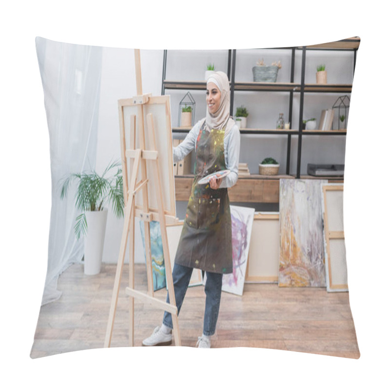 Personality  Full Length View Of Happy Muslim Woman In Apron Drawing On Easel At Home Pillow Covers