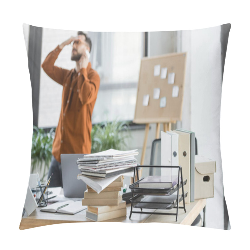 Personality  Busy And Tired Businessman Talking On Smartphone While Solving Problem Near Corkboard With Sticky Notes And Work Desk With Notebooks, Books, Cardboard Box And Laptop, Blurred Background Pillow Covers