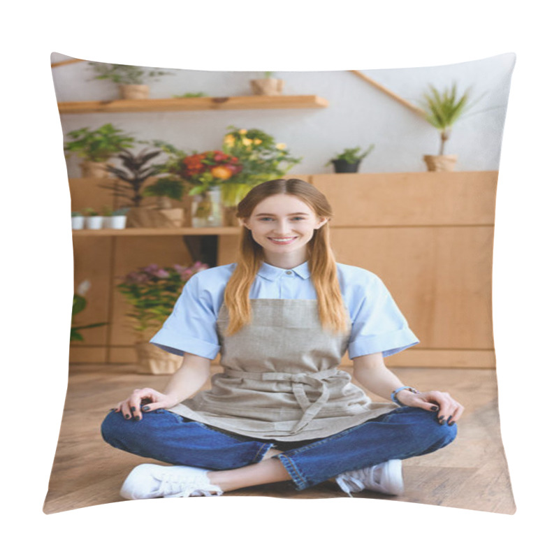 Personality  Beautiful Young Woman In Apron Sitting On Floor And Smiling At Camera In Flower Shop  Pillow Covers