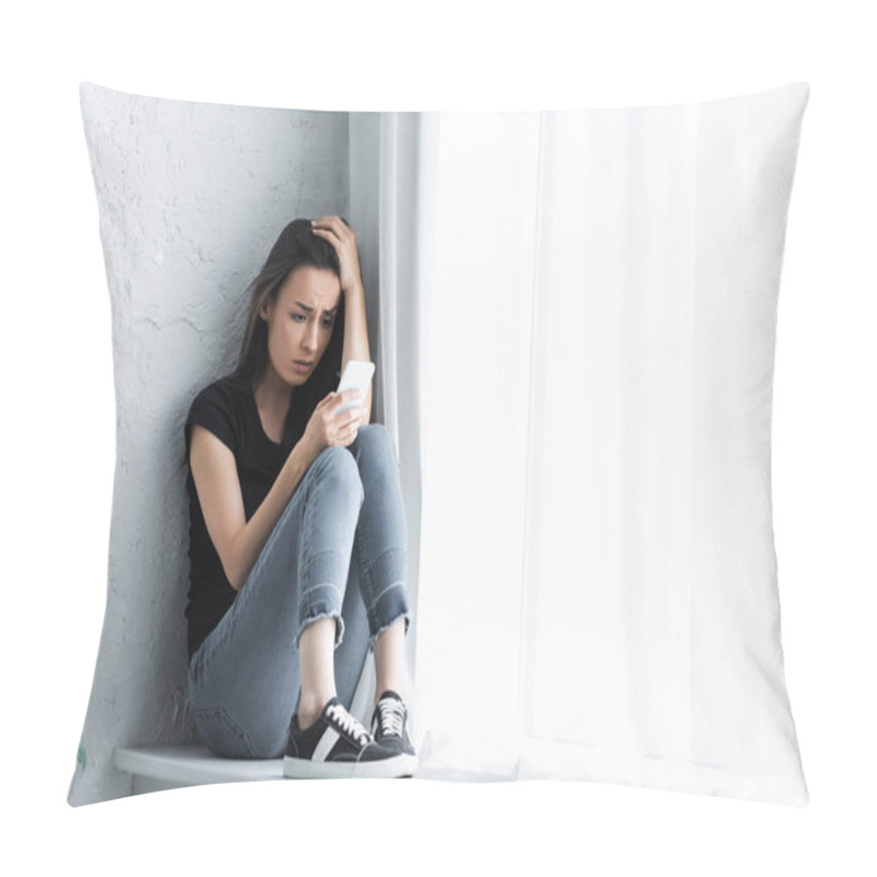 Personality  Depressed Young Woman Sitting On Window Sill At Home And Using Smartphone Pillow Covers