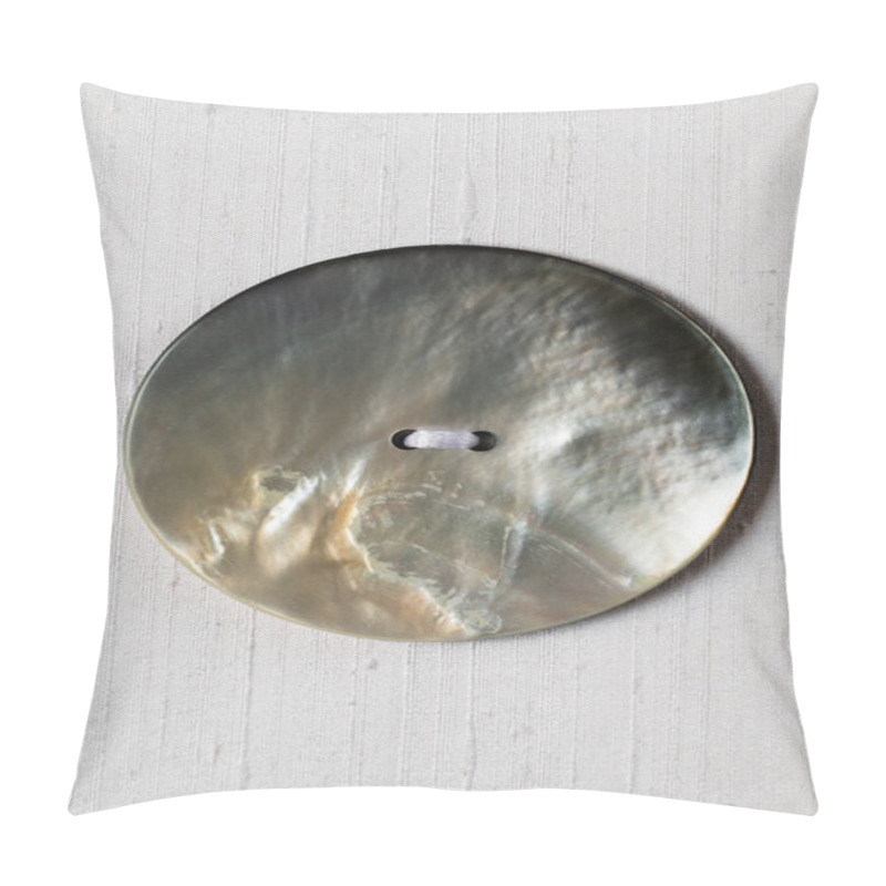 Personality  A Detailed Close-up Of A Mother Of Pearl Button Resting On A Fabric Surface. The Buttons Glossy Texture Reflects The Light, Showcasing Its Iridescent Quality. Pillow Covers