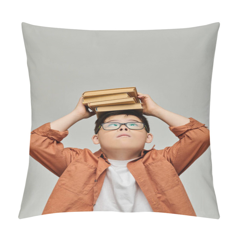 Personality  A Little Boy With Down Syndrome Balances A Stack Of Books On His Head. Pillow Covers