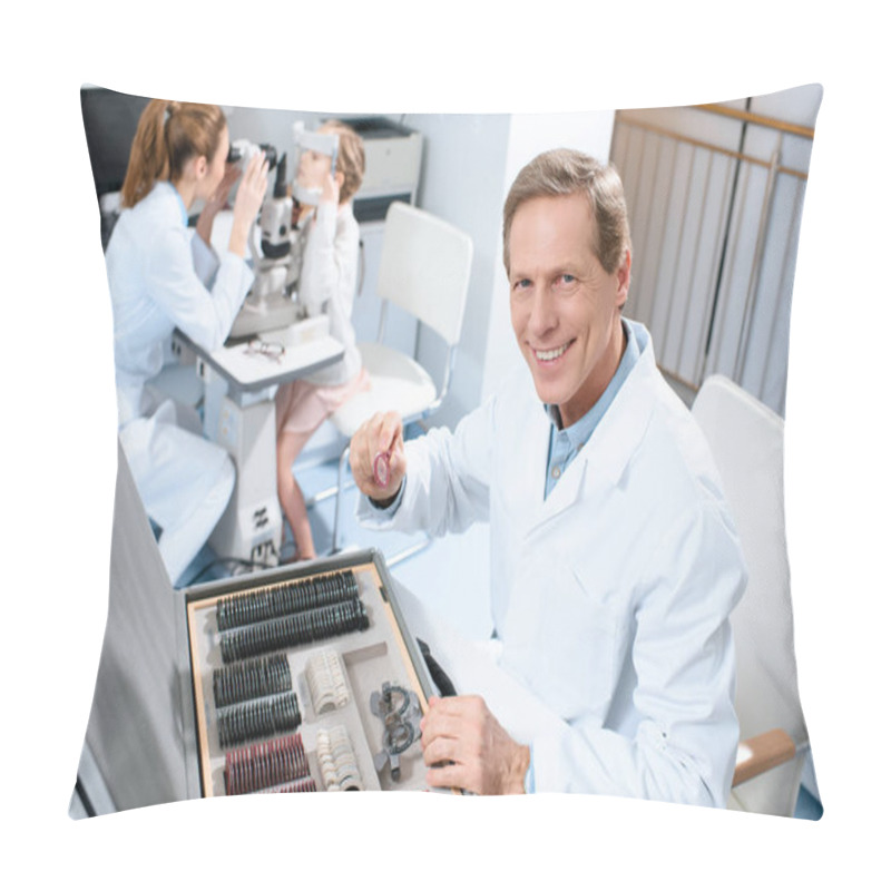 Personality  Male Optometrist Holding Lenses For Trial Frame While Colleague Examining Kid With Visual Field Test Pillow Covers