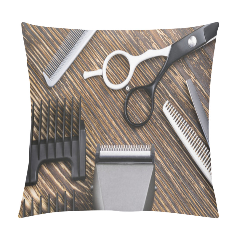 Personality  Comb, Scissors, Razor And Hair Clipper Lie On A Brown Wooden Table Pillow Covers