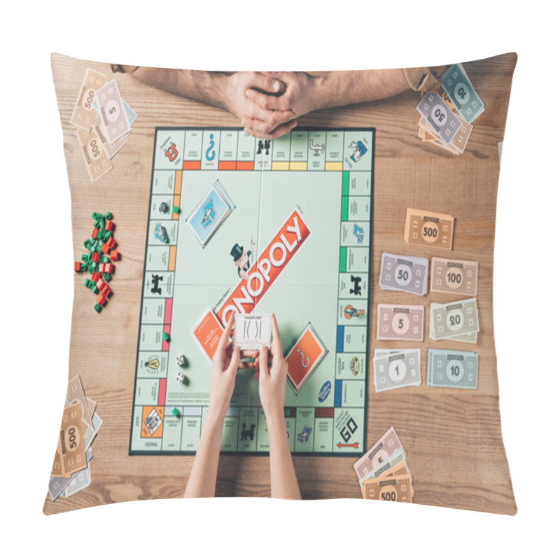 Personality  KYIV, UKRAINE - NOVEMBER 15, 2019: Cropped View Of Woman And Man Playing Monopoly Board Game At Table Pillow Covers