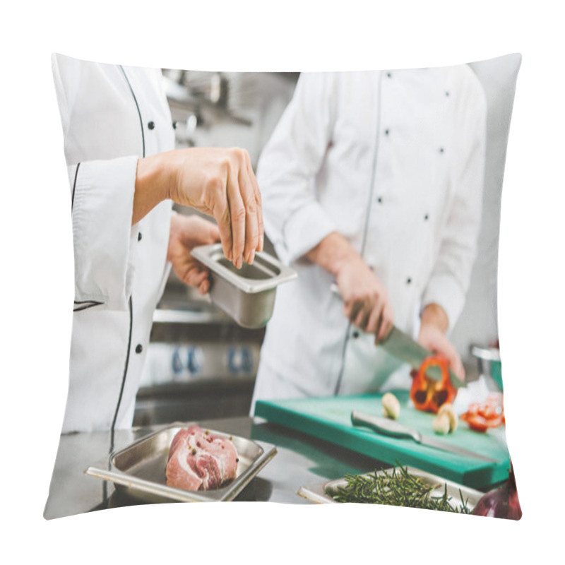 Personality  Cropped View Of Female Chef Seasoning Meat While Man Cooking On Background In Restaurant Kitchen Pillow Covers