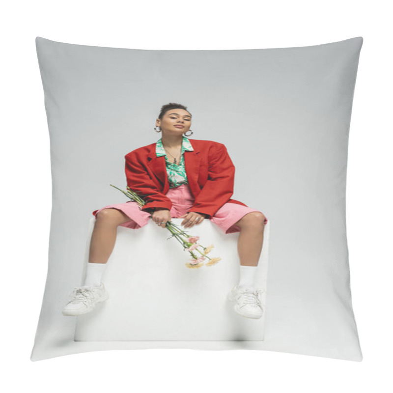 Personality  African American Woman In Stylish Red Blazer Holding Flowers And Sitting On Cube On Grey Backdrop Pillow Covers