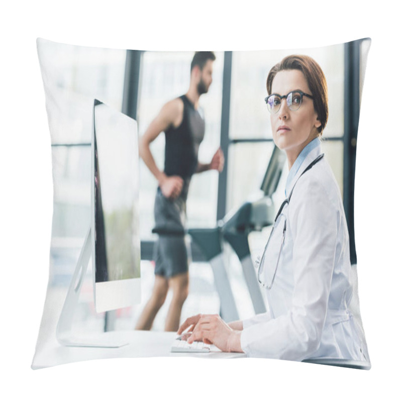 Personality  Doctor In Glasses Using Computer While Sportsman Running On Treadmill During Endurance Test In Gym Pillow Covers