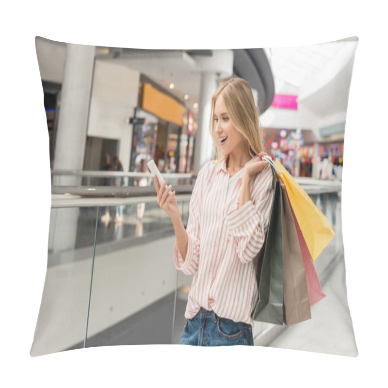 Personality  Young Smiling Female Shopper With Paper Bags Using Smartphone At Shopping Mall  Pillow Covers