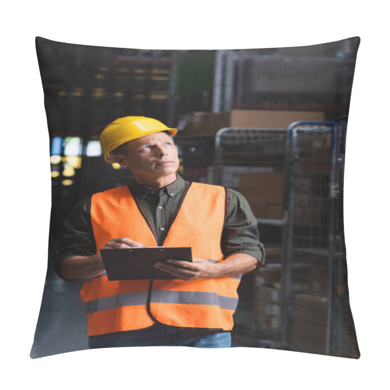 Personality  Thoughtful Middle Aged Supervisor In Hard Hat Reviewing Paperwork In Warehouse, Logistics And Cargo Pillow Covers