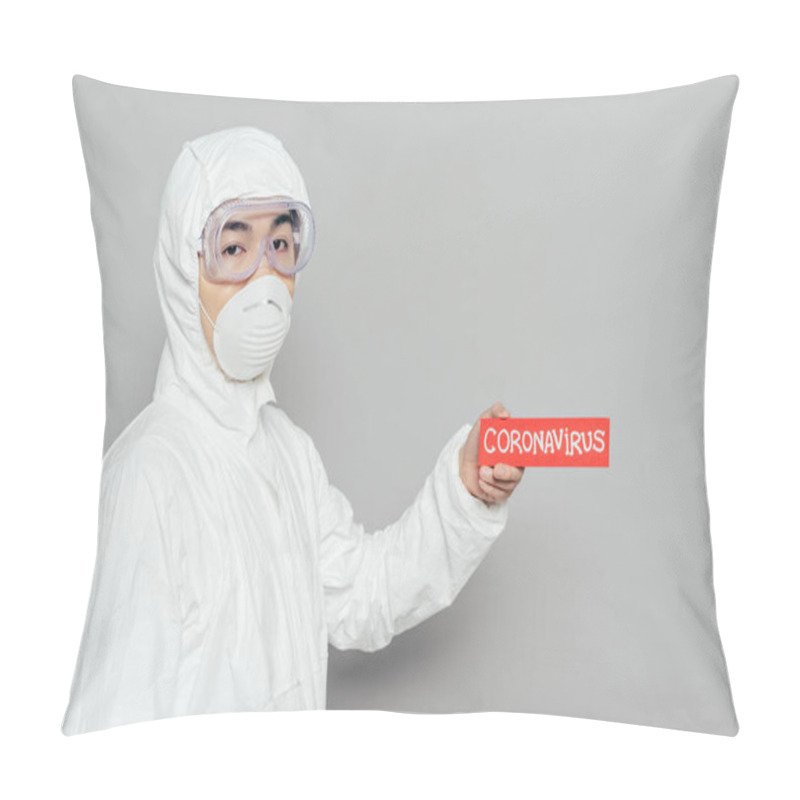 Personality  Asian Epidemiologist In Hazmat Suit And Respirator Mask Holding Warning Card With Coronavirus Inscription On Grey Background Pillow Covers