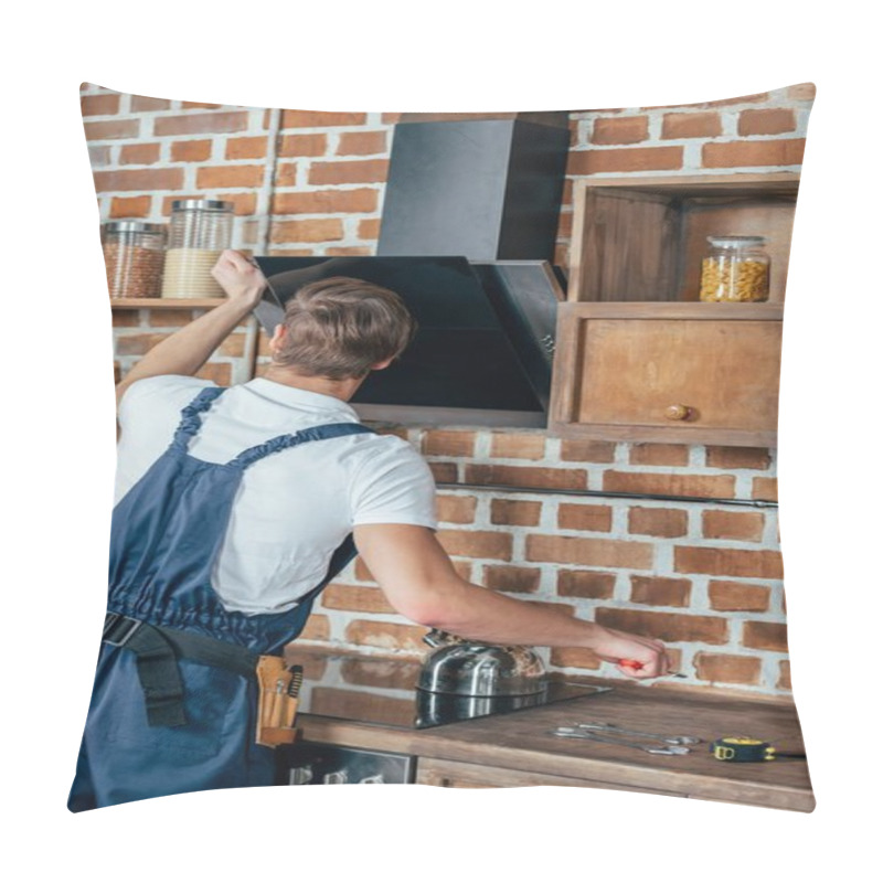 Personality  Back View Of Young Handyman Fixing Extractor Hood In Kitchen Pillow Covers