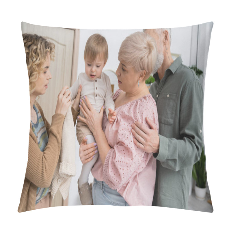 Personality  Blonde Woman Undressing Toddler Daughter In Hall Of Apartment During Visit To Mature Parents Pillow Covers