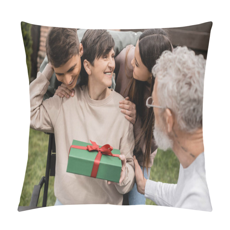 Personality  Positive Children Hugging Middle Aged Mother Holding Gift Box Near Blurred Husband While Spending Time During Parents Day Celebration At Backyard In June, Cherishing Family Bonds Concept Pillow Covers