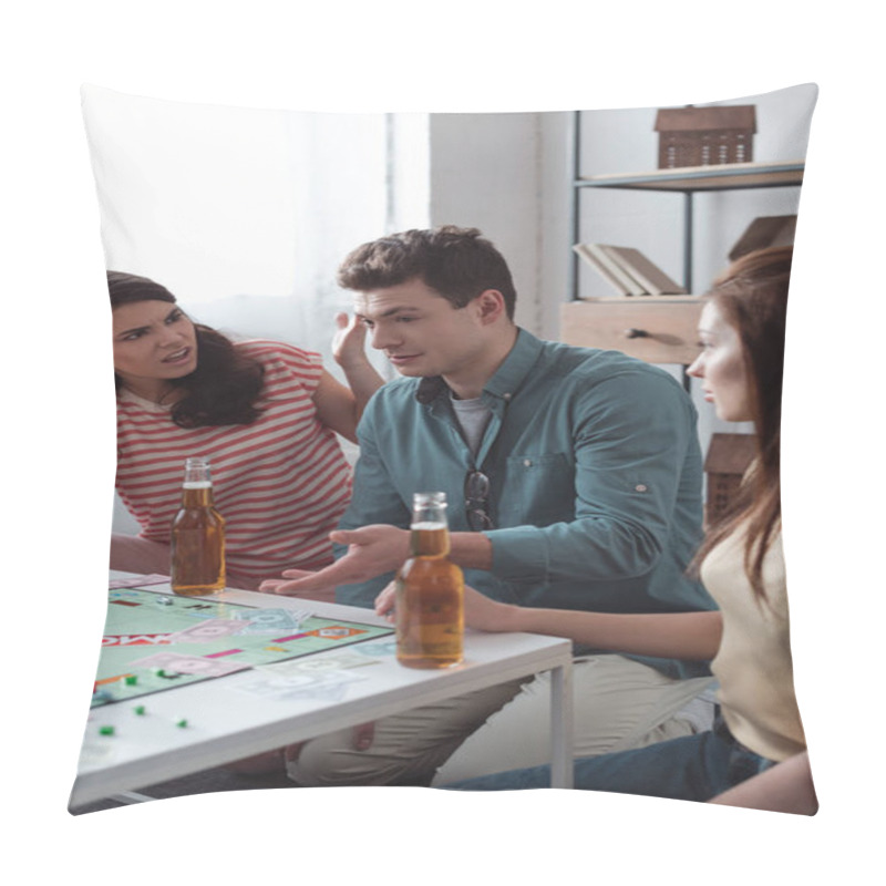 Personality  KYIV, UKRAINE - JANUARY 27, 2020: Angry Girl Gesturing Near Confused Man While Playing Monopoly Game Pillow Covers