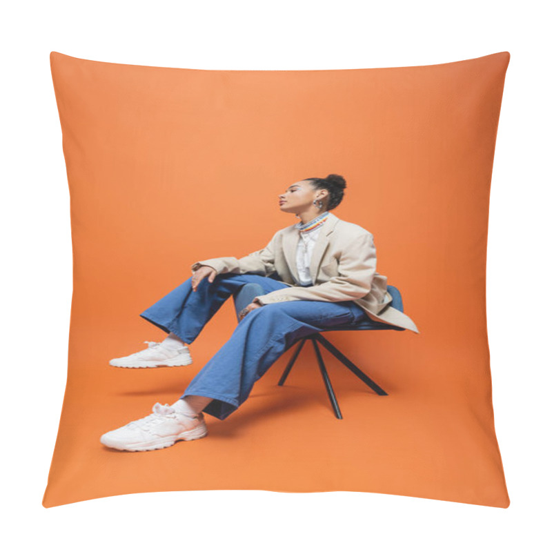 Personality  Stylish African American Model In Fashionable And Trendy Outfit Sitting On Blue Chair Looking Away Pillow Covers