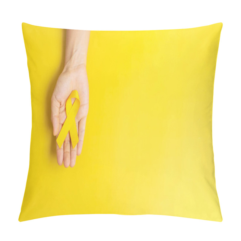 Personality  Hand Holding Yellow Ribbon On Yellow Background For Supporting People Living And Illness. Suicide Prevention Day, Sarcoma Cancer And Childhood Cancer Awareness Month Concept Pillow Covers