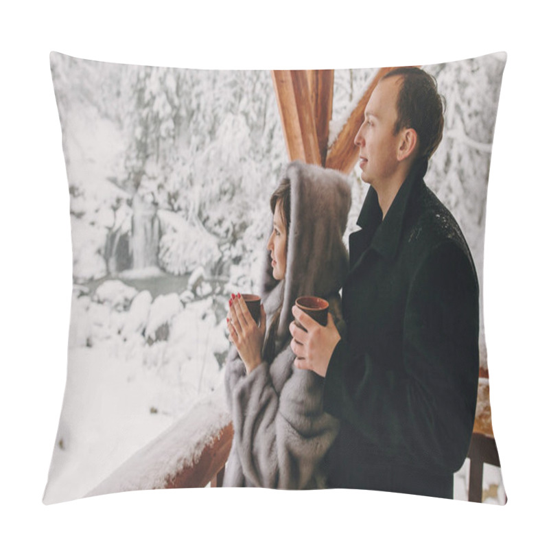 Personality  Stylish Couple Holding Hot Tea In Cups And Looking At Winter Snowy Mountains From Wooden Porch. Happy Romantic Family With Drinks Relaxing In Snow Woods. Holiday Getaway Together Pillow Covers