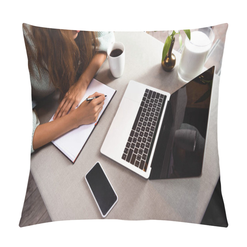 Personality  Cropped View Of Woman Writing In Notepad In Cafe With Smartphone And Laptop Pillow Covers