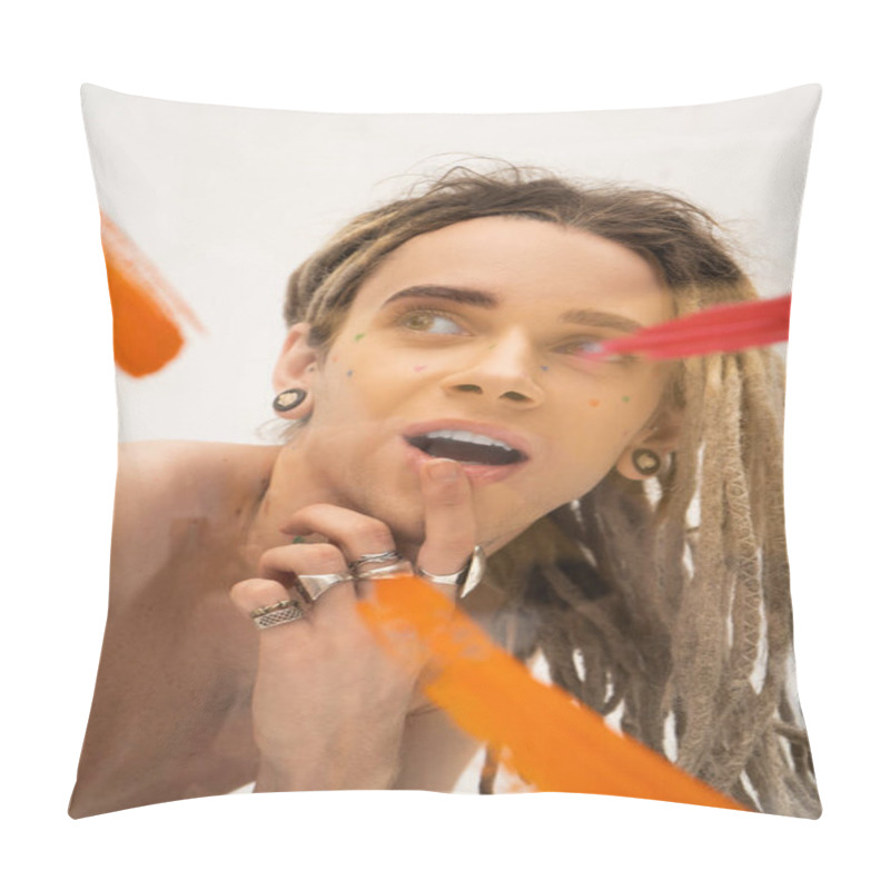 Personality  Portrait Of Excited Queer Model With Dreadlocks Touching Lip And Looking Away Near  Paint Strokes On White  Pillow Covers