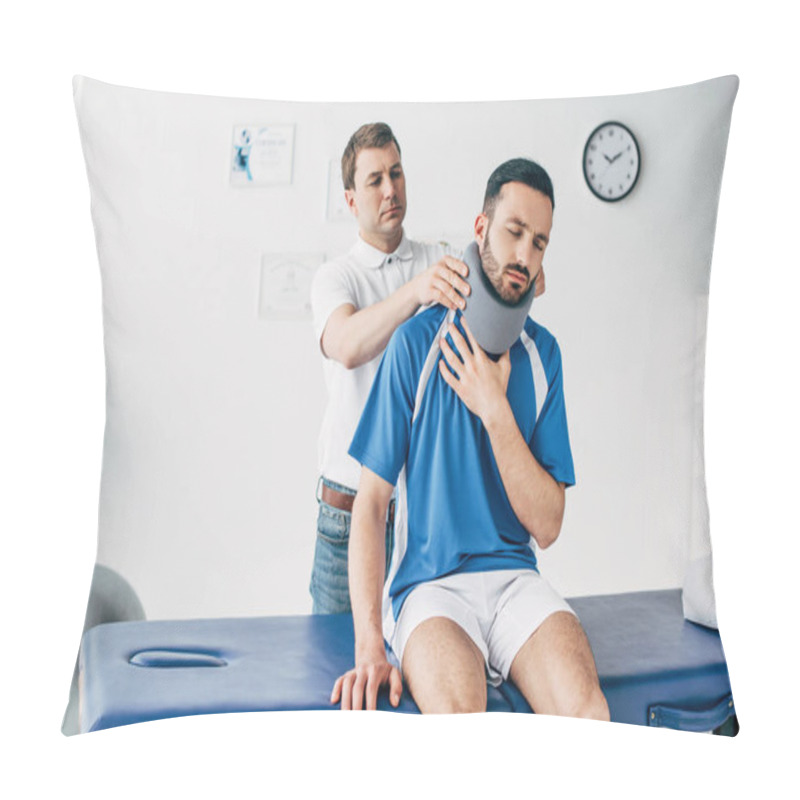 Personality  Chiropractor Examining Football Player In Neck Brace In Hospital Pillow Covers