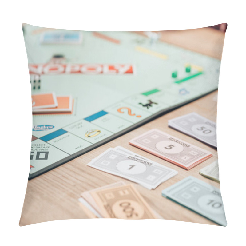 Personality  KYIV, UKRAINE - NOVEMBER 15, 2019: Selective Focus Of Toy Currency And Monopoly Game On Wooden Table Pillow Covers