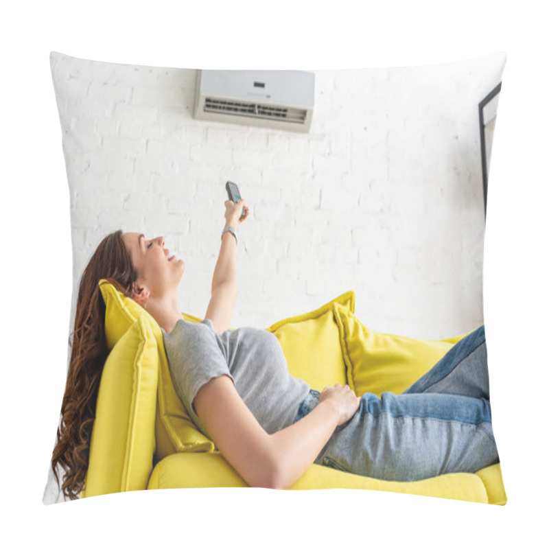 Personality  Attractive Young Woman Relaxing Under Air Conditioner And Holding Remote Control Pillow Covers