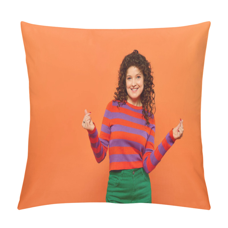 Personality  A Young Woman With Curly Hair Smiles Brightly While Posing In Vibrant Attire Against A Bright Orange Background. Pillow Covers