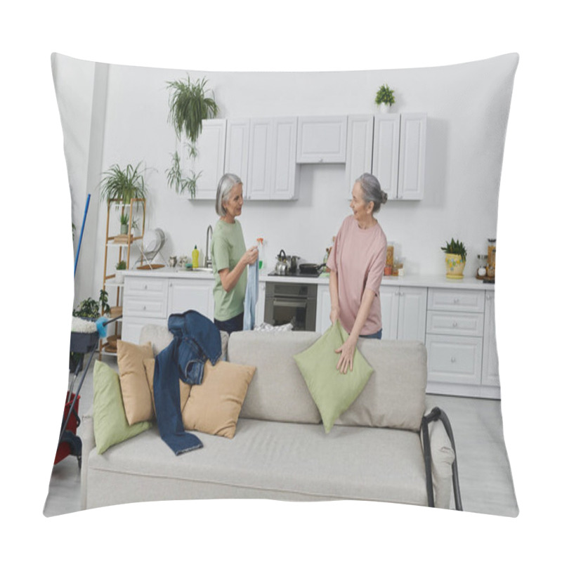 Personality  A Mature Lesbian Couple Cleans Their Modern Apartment Together, One Woman Placing A Pillow On The Couch. Pillow Covers