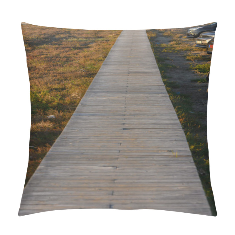 Personality  A Serene Wooden Pathway Unfolds Across Lush Grasslands, Glowing Softly In The Warm Evening Light. Pillow Covers