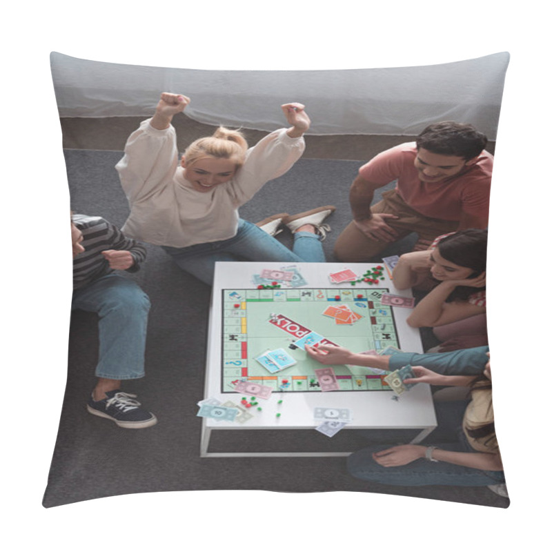 Personality  KYIV, UKRAINE - JANUARY 27, 2020: Overhead View Of Excited Girl Showing Winner Gesture While Playing Monopoly Game With Smiling Friends Pillow Covers