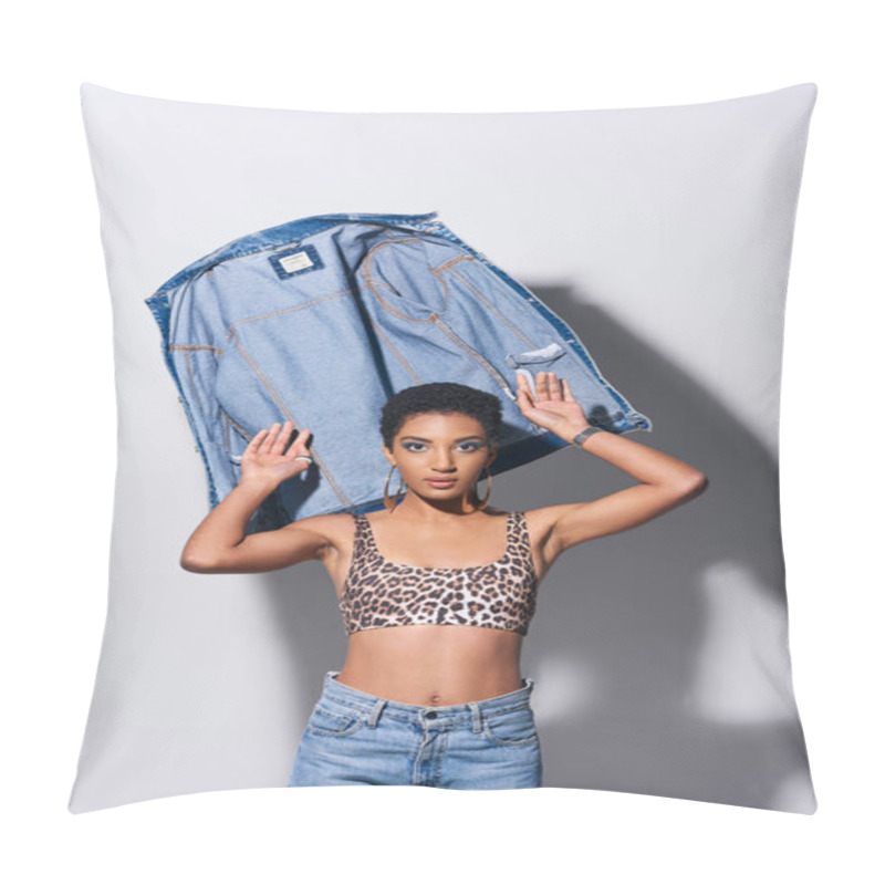 Personality  Trendy African American Young Model With Short Hair In Top With Leopard Print And Jeans Looking At Camera Near Denim Jacket On Grey Background, Denim Fashion Concept Pillow Covers